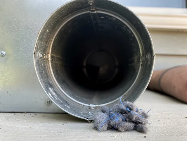 Hacienda Heights Dryer Vent Cleaning technician using specialized equipment to clear severe dryer vent blockage in Hacienda Heights